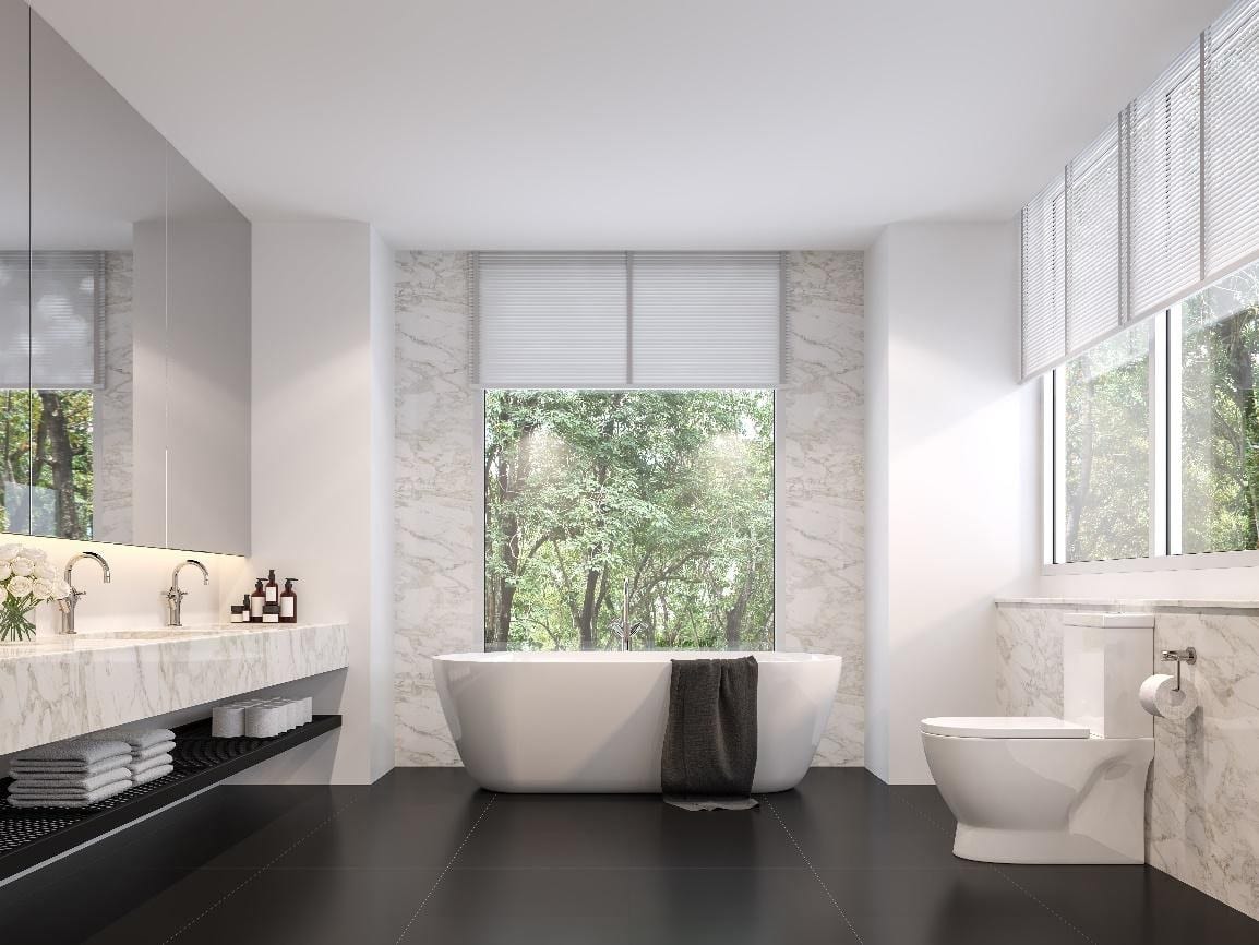 Luxurious bathroom with natural views, black tile floors, white marble walls, and light venetian window blinds